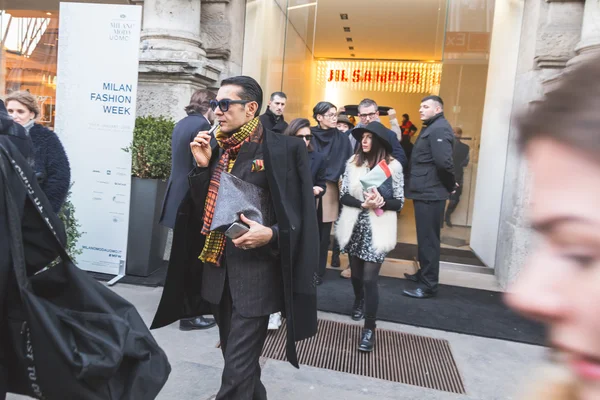People outside Jil Sander fashion show building for Milan Men\'s