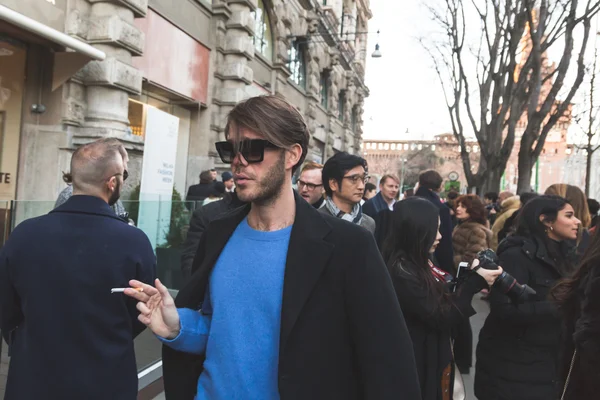 People outside Jil Sander fashion show building for Milan Men's