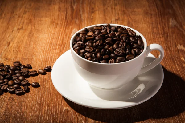 Still-life with a cup of coffee beans