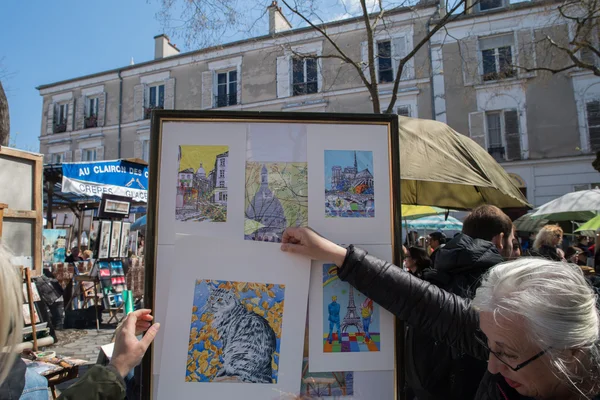 PARIS, FRANCE - MAY 1 2016 - Artist and tourist in Montmartre