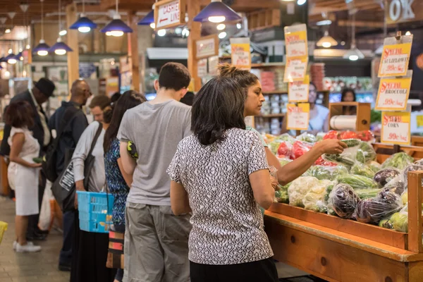PHILADELPHIA, USA - JUNE 19, 2016 - People buying and eating at city market