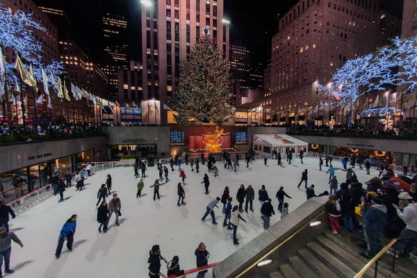 NEW YORK, USA - DECEMBER 9, 2011 - People skating at rockfeller center celebrating xmas