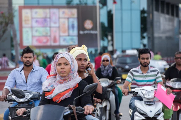 MALE, MALDIVES - FEBRUARY, 13 2016 - People in the street before evening pray time in male maldives capital small island town heavy traffic jam