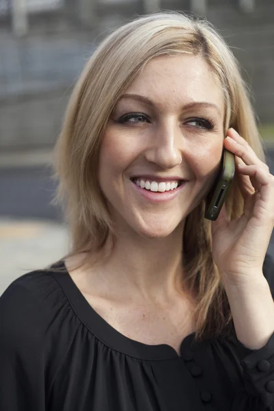 Woman in Black Top Talking on Cell Phone