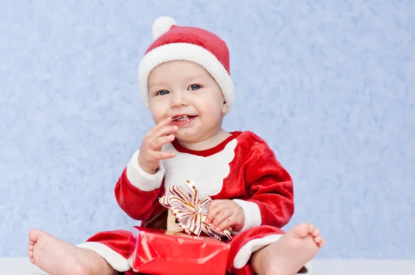 Cute baby boy santa helper