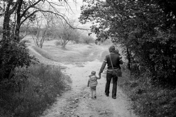 Father with young daughter and son