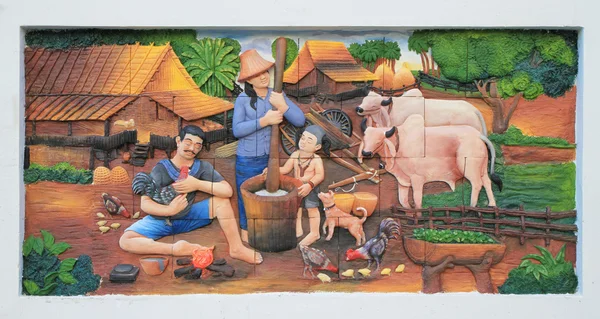 Stone carving and painting of Traditional Thai culture on temple wall