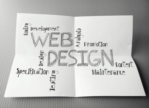 Hand drawn web design diagram on crumpled paper background as co