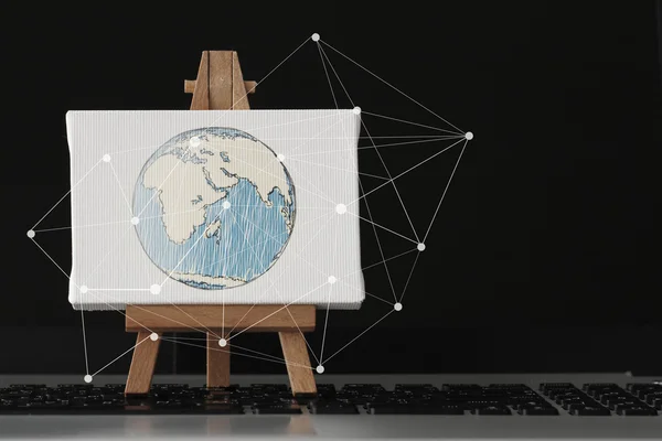 Hand drawn globe with social network diagram on canvas and woode