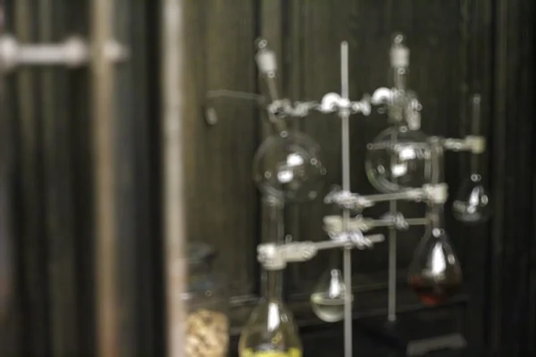 Blurred vintage chemistry bottles background