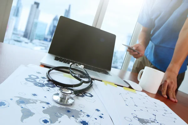 Doctor working with laptop computer in medical workspace office