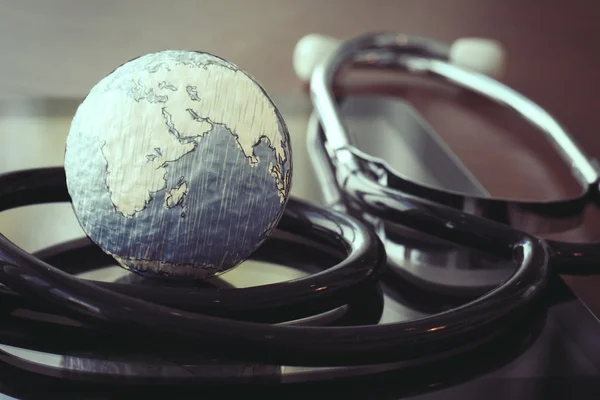 Stethoscope and texture globe with digital tablet as medical net