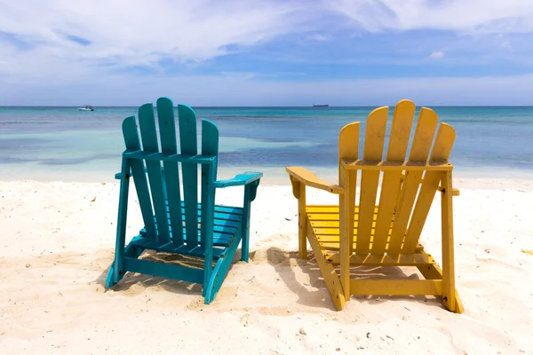 Colorful chairs on caribbean coast