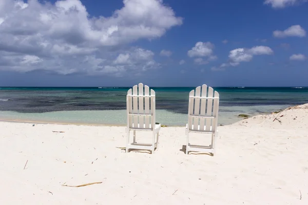 White restaurant chairs on the beach
