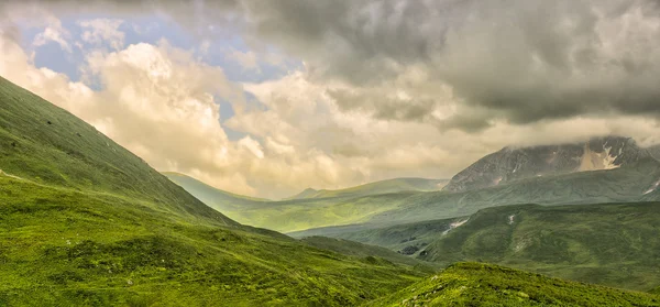 Mountain panorama with clouds.