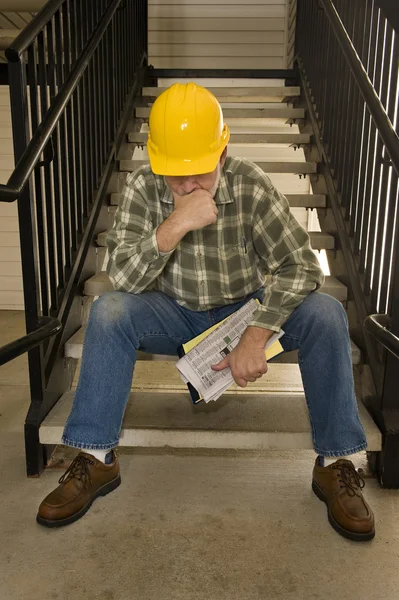 Laid Off Construction Worker Looking Distressed