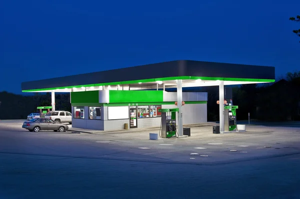 Retail Convenience Store At Night And Gas Station