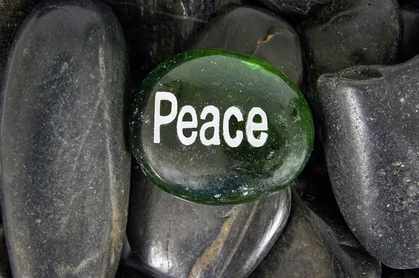The Word Peace Hand Painted On Green Encouragement Stone