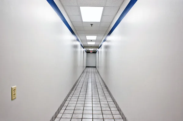 Very Long Empty Hallway In Business Office Building