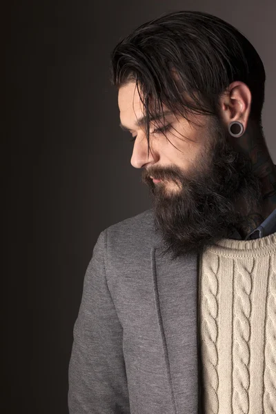 Beard, tattoos and ear-piercing