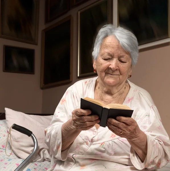 Old woman reading the Bible