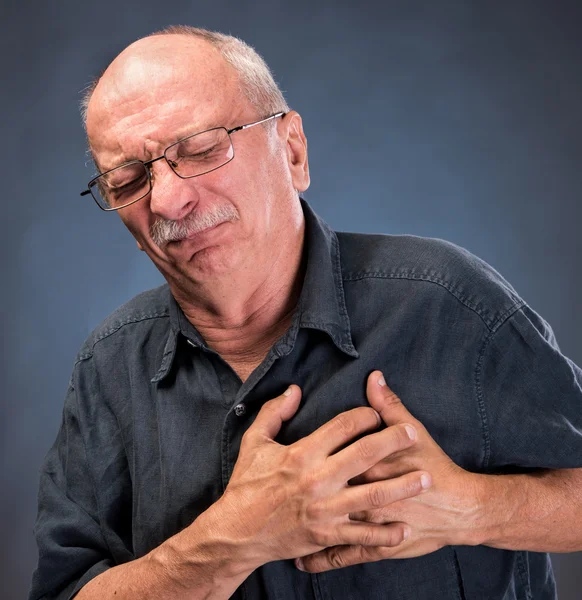 Man in glasses having a heart attack