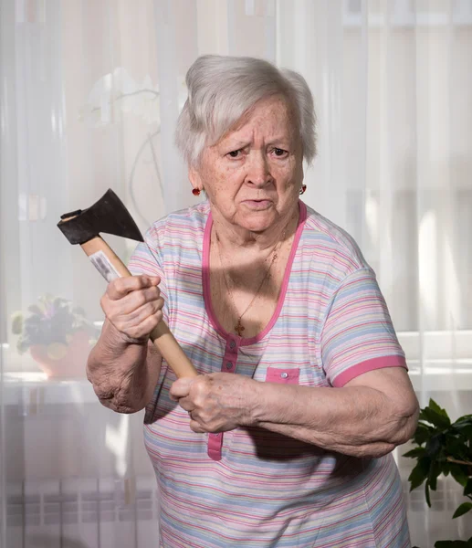 Angry old woman with an ax