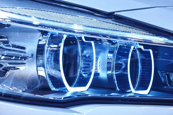Car light detail in blue tone Vehicle part. Vertical