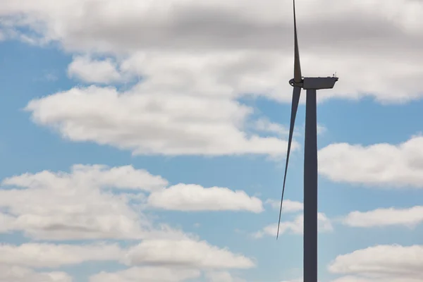 Wind turbine and blue sky. Clean alternative renewable energy