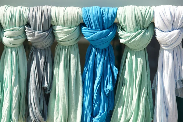 Green and blue ladies scarves in a tourist shop. Crete. Greece