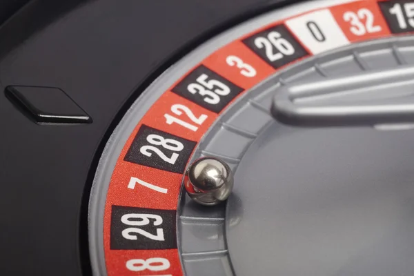 Casino roulette detail with ball in number seven. Gambling