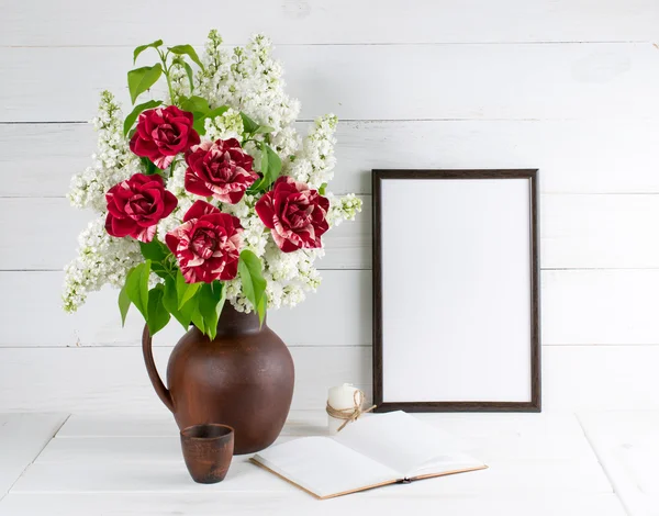 Lilac bouquet with roses in clay jug with motivational frame  fo