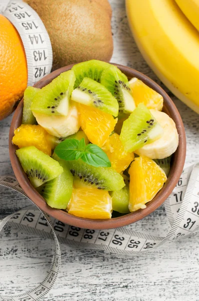 Fruit salad with kiwi, banana and orange and centimeter