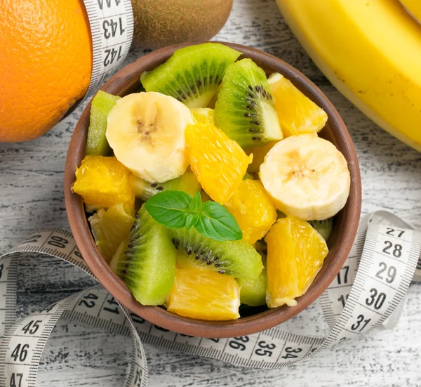 Fruit salad with kiwi, banana and orange and centimeter