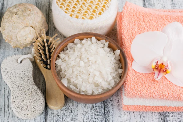 Spa salon with sea salt, towels and flowers