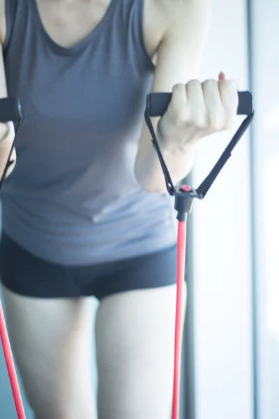 Woman exercising exercise bands