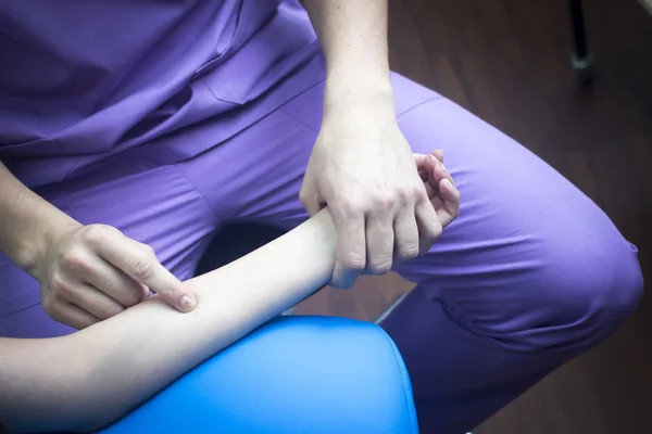 Physiotherapist massaging patient mobility injury