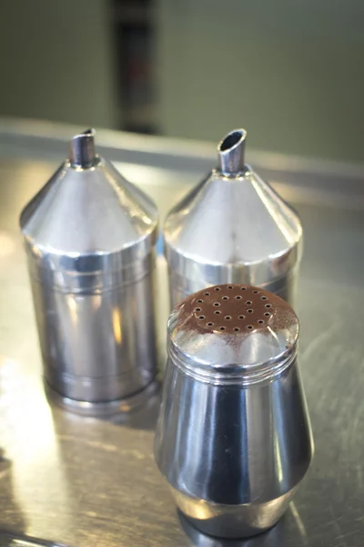 Coffee sugar cocoa dispensers in cafe bar