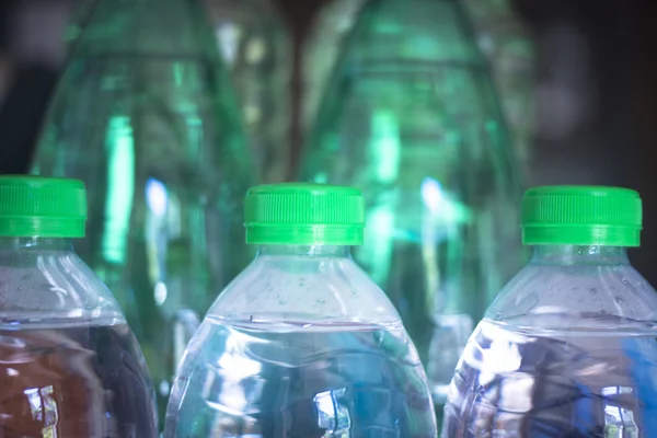 Plastic water bottles in window light