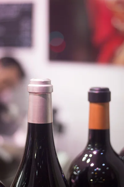 White and red wine bottles in dinner party