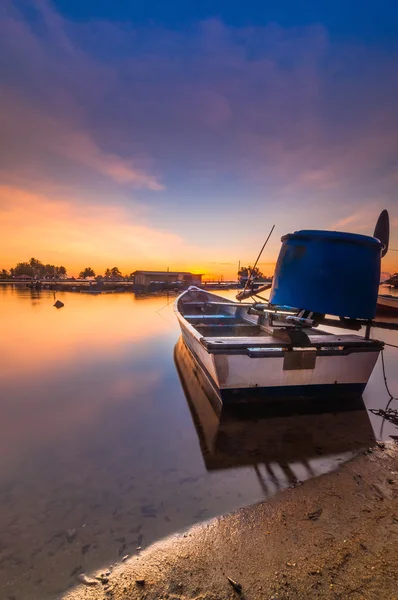 Single boats during sunrise