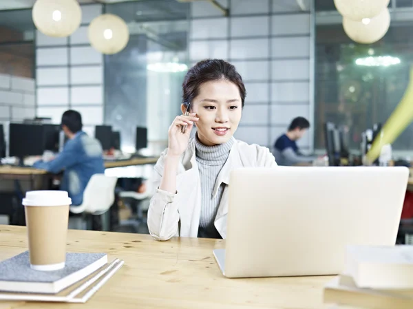 Young asian businesswoman working in office