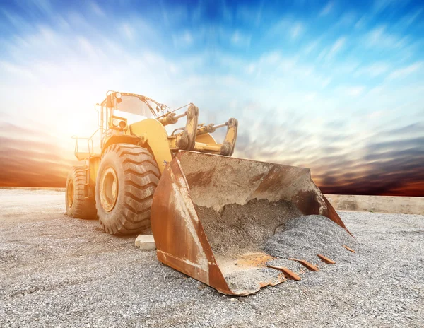 Big excavator on new construction site