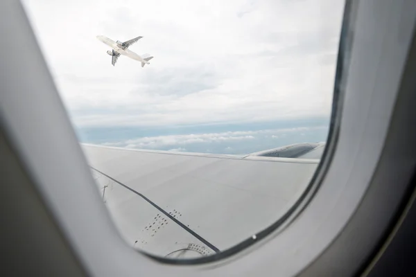 Sky through window of an aircraft