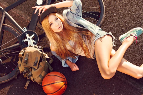 Blonde girl with sport bicycle