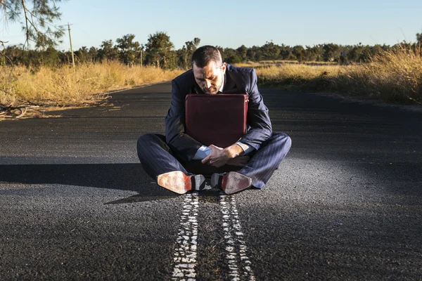 Frustrated businessman in the outback