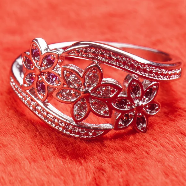 Silver Ring decorated with precious stones sapphire, ruby