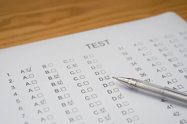 Test score sheet with answers and ballpoint