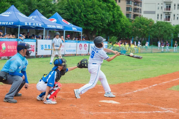 Batter just missed the ball in a baseball game