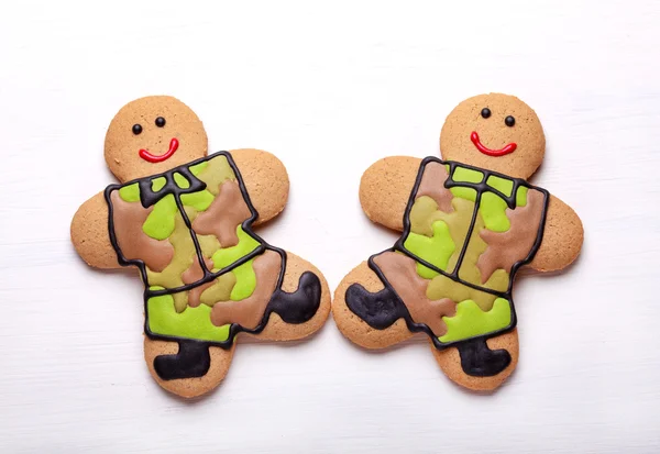Homemade Gingerbread men in protective khaki uniforms on Defende